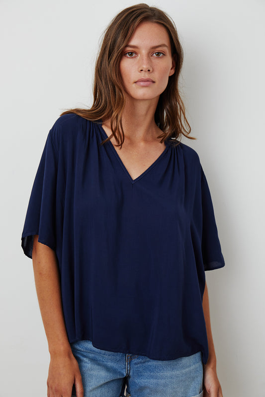 JAYCEE SPLIT NECK BLOUSE IN POSTMAN